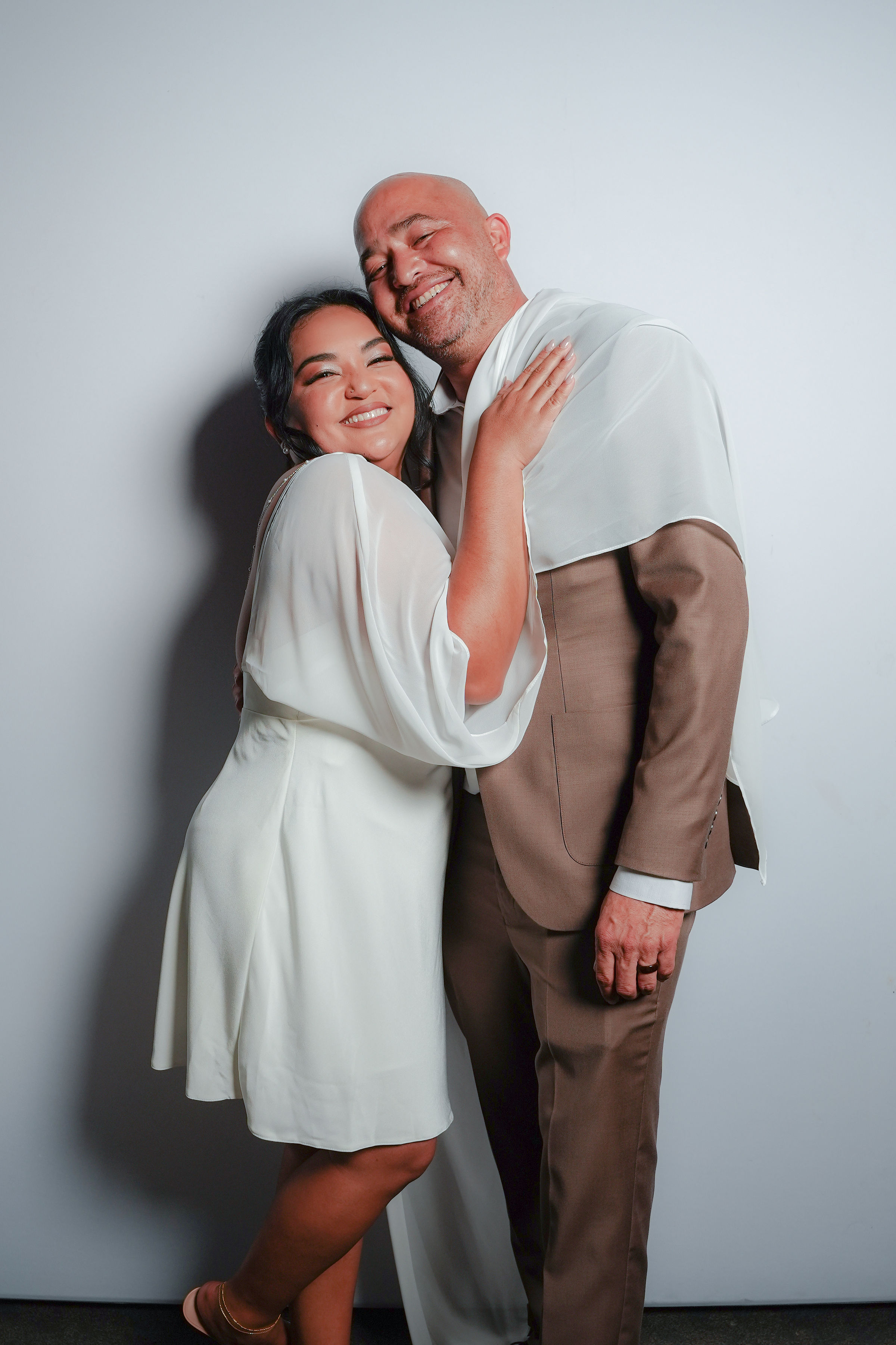 Bride and groom embracing in the Stel Star portrait booth
